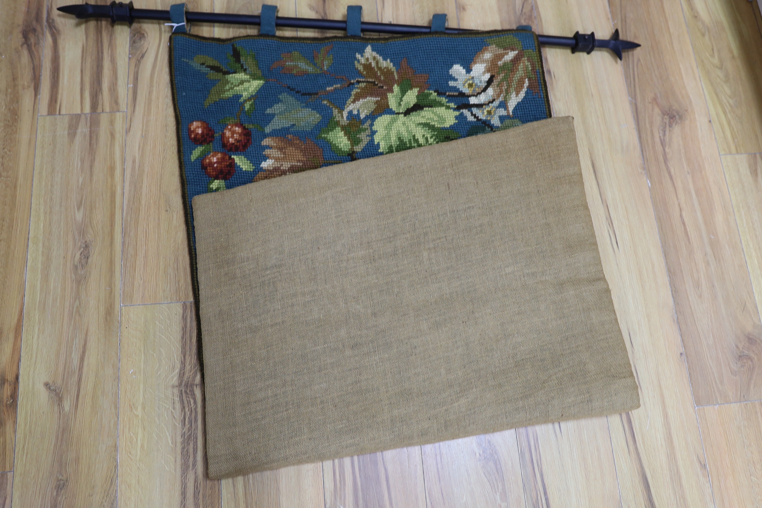 A 20th century woolworked hanging, leaves and flowers, monogrammed and dated